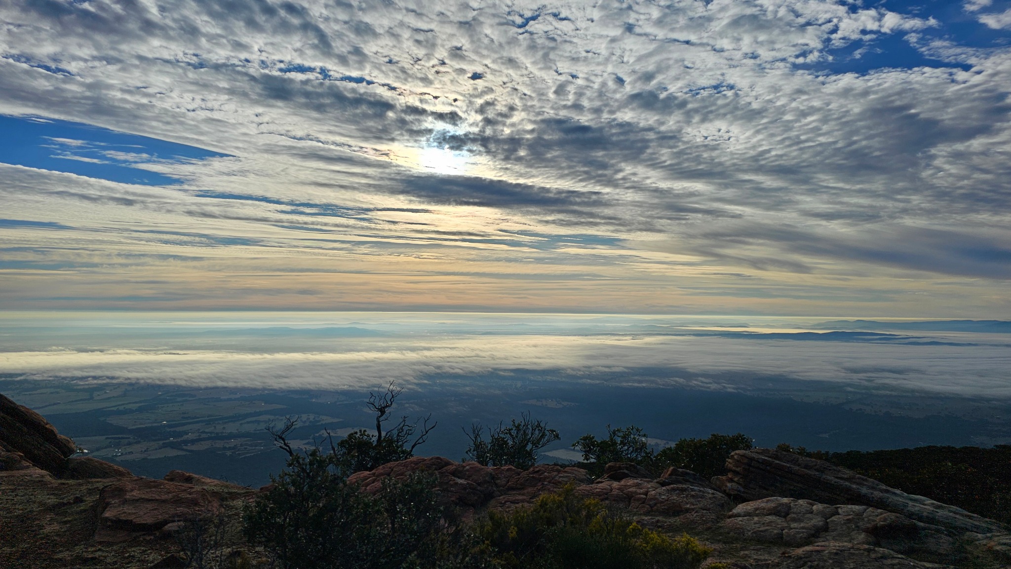 High mountain view above a layer of cloud